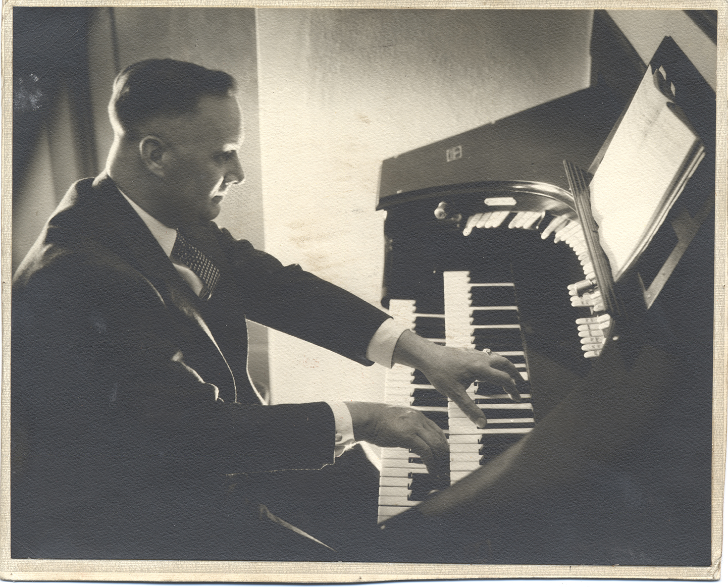 Photograph of Frank B. Robinson playing his organ